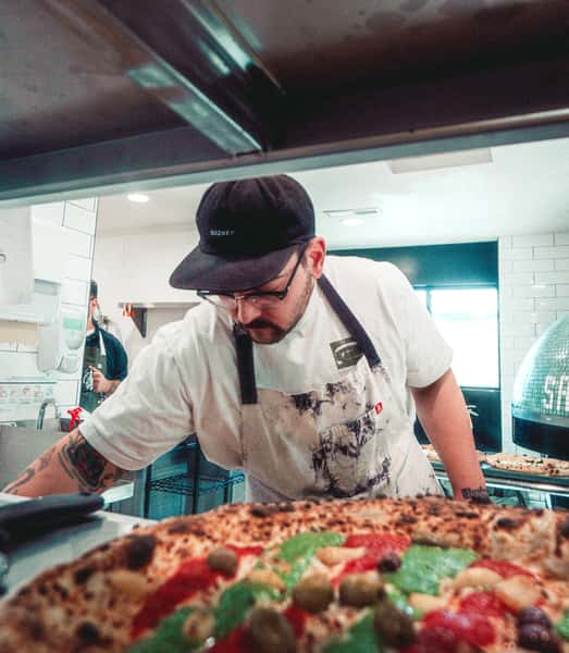Chef cooking a pizza