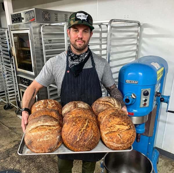 loaves of sourdough on tra