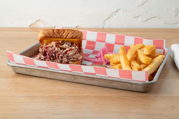 Smoked turkey barbecue plate with Southern sides and Texas toast at North Georgia BBQ