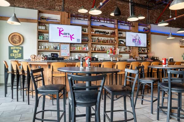 Bar and dining area inside North Georgia BBQ featuring rustic decor, craft beverages, and welcoming Southern hospitality