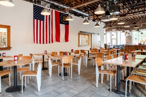 Dining room interior at North Georgia BBQ featuring rustic Southern decor, spacious seating, and welcoming smokehouse atmosphere