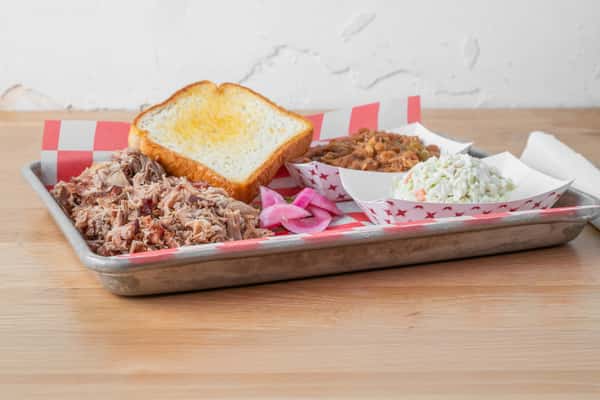 Chopped pork barbecue plate with Texas toast, potato salad, and Southern sides at North Georgia BBQ