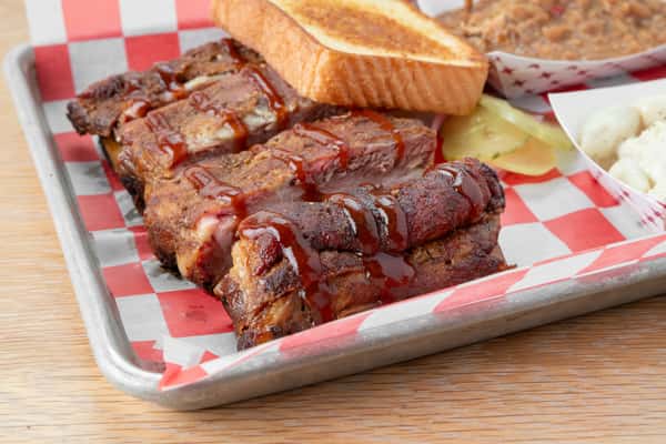Smoked barbecue ribs plate with Texas toast and Southern sides at North Georgia BBQ