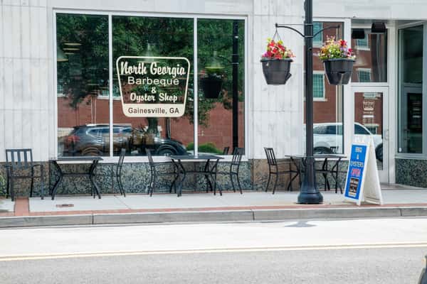 Front exterior of North Georgia BBQ in Gainesville, Georgia, showcasing the restaurant storefront and outdoor seating