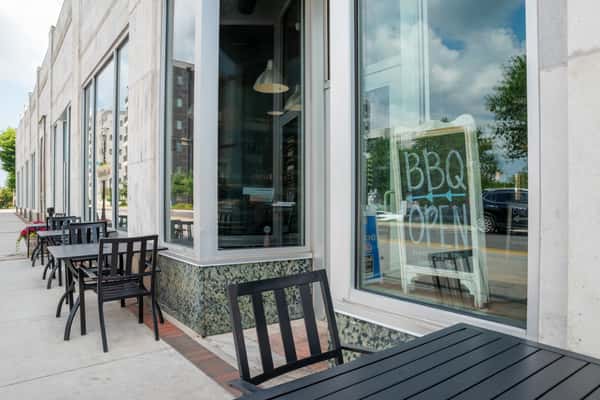 Sidewalk entrance and outdoor seating area at North Georgia BBQ restaurant in North Georgia