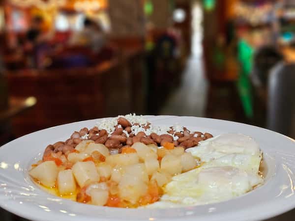 2 sunny side eggs with Mexican style potatoes