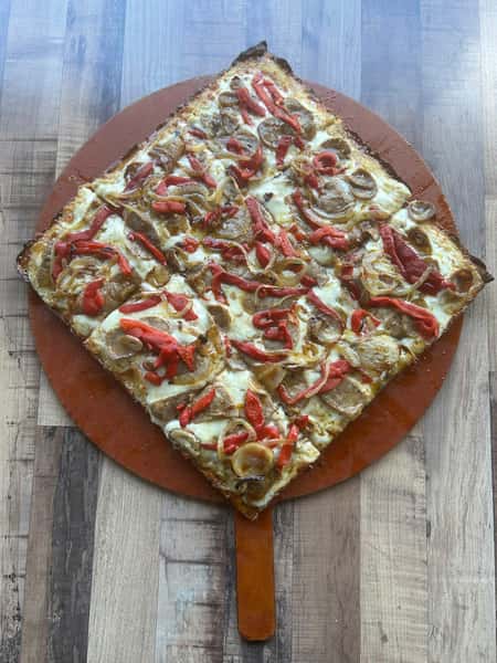 Square pizza topped with sliced sausage, roasted red peppers, and caramelized onions on a golden, crispy crust.