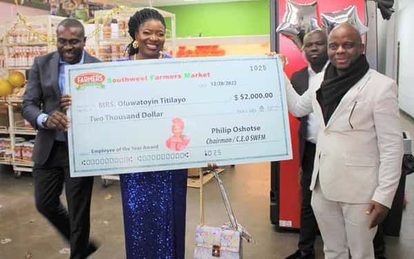 owner presenting check and community event
