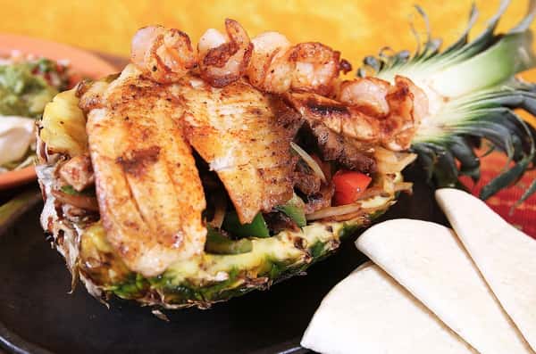 fish entree in half pineapple