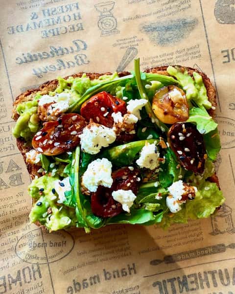 avocado toast with arugula, balsamic glazed roasted tomatoes & goat cheese