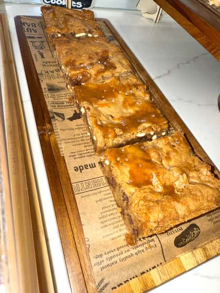 blondie loaded with every delicious mix-in you can imagine—chunks of chocolate, caramel, pretzels topped with flaky salt