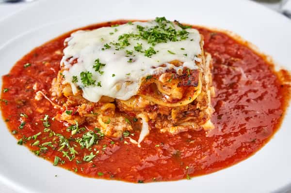 Classic Meat Lasagna Served with Marinara Sauce on The Side
