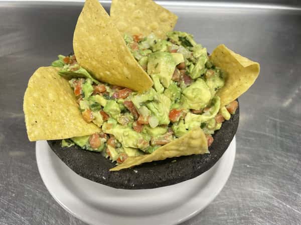 guacamole topped with tortilla chips