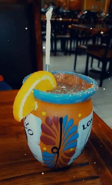 alcoholic beverage with an orange slice