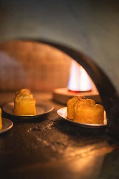Food baking in brick oven