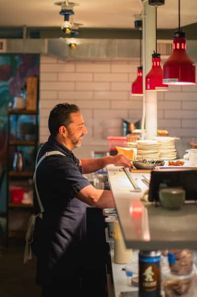 Chef plating meals in Lucinda kitchen