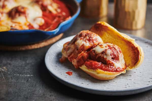 Can't decide what to order? 🤔 Let us make it easy for you! Dive into our crowd-pleaser, the Meatball Parmigiana Sub. With each mouthful, you'll experience the unbeatable combination of juicy meatballs smothered in our secret sauce and topped with melted cheese. It's a fan favorite for a reason! Come find out why today at Tony's Pizza and DraftHouse. #TonysPizzaAndDraftHouse #MeatballParmigianaSub #FoodieFavorites 🍴🥖