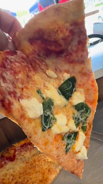Another angle from our slice of the day spinach ricotta shredded Parmesan and mozzarella
