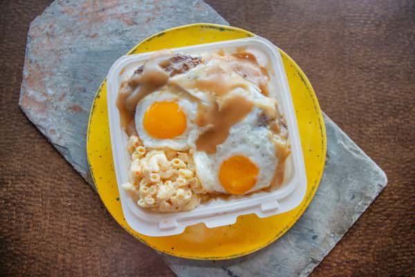 Loco moco plate with sunny side up fried eggs