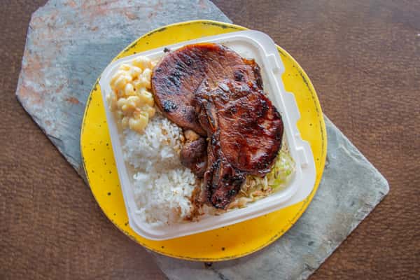Hawaiian-style BBQ pork chops served with rice and macaroni salad