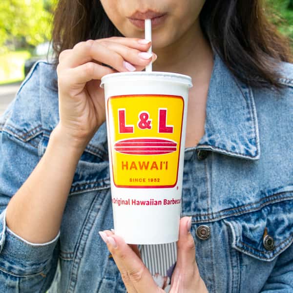 Woman drinking L&L fountain drink