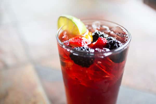 cocktail with berries and lemon