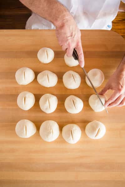 fresh dough balls being prepped