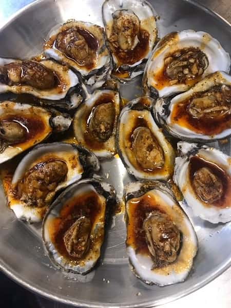 raw oysters on the half shell with special sauce