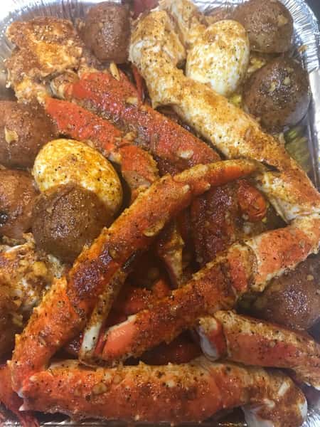 seasoned crab legs and corn