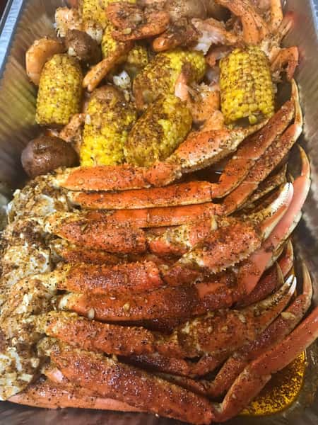 seasoned crab legs and corn