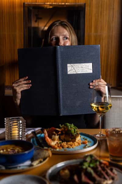 Guest holding a menu