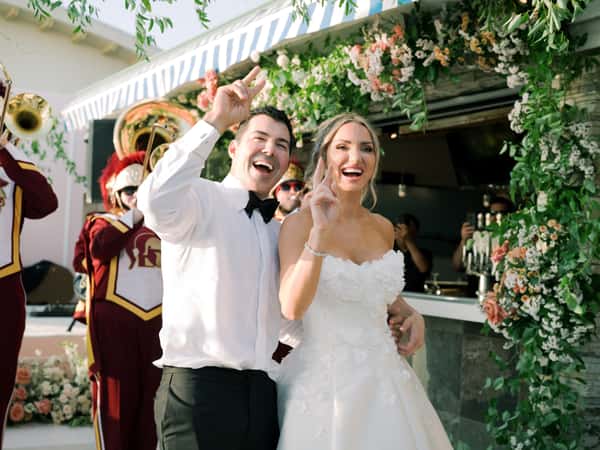 Bride and groom entering the wedding reception venue space