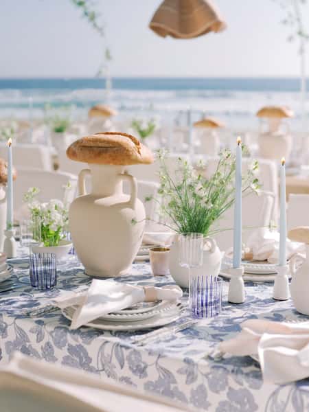 Table decorations and place settings for a wedding reception
