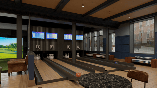 Stylish indoor bowling lanes inside a modern entertainment bar, featuring digital score screens, leather seating, and polished wood lanes.