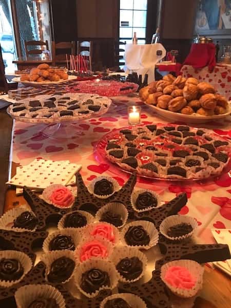 an assortment of chocolates and pastries on a table
