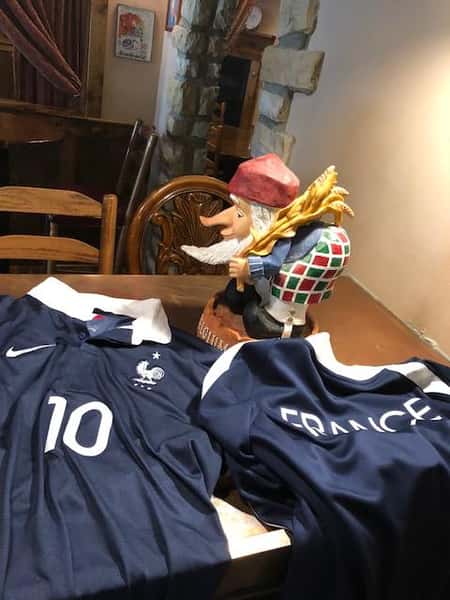 France jerseys on a table with a gnome