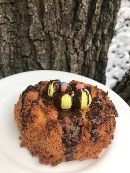 crumb cake covered in chocolate and mini chocolate eggs