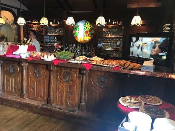 an assortment of desserts on top of the bar counter top