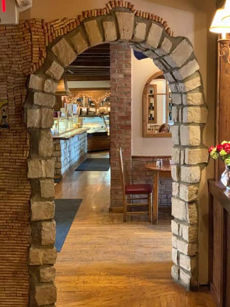 Brick archway entrance into dining room
