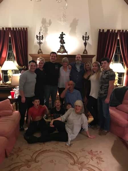 family sitting in a living room posing for a picture