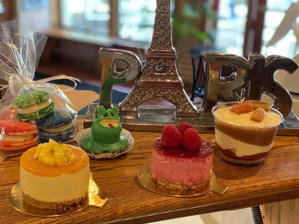 miniature eifel tower on a table with pastries
