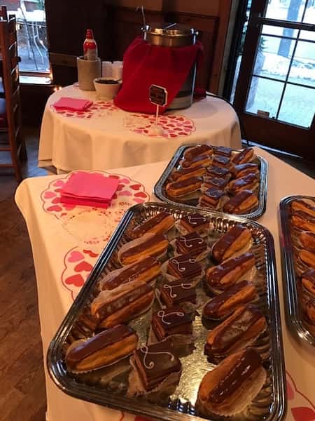 An assortment of eclairs on a tray