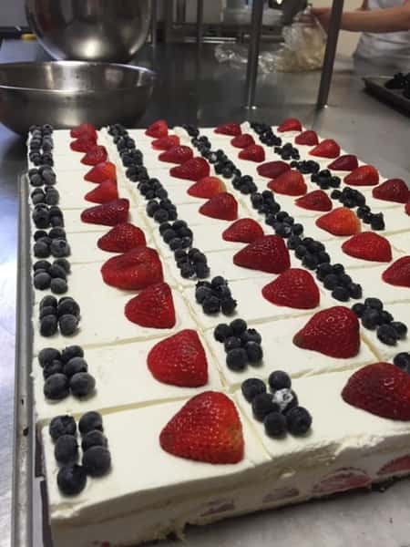 strawberry shortcake topped with strawberries and blueberries