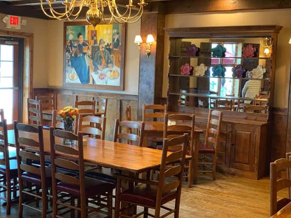 dining room with table and chairs and art displayed on the wall