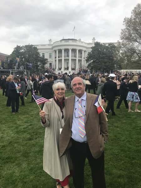 man and woman posing for a photo in front of the white house