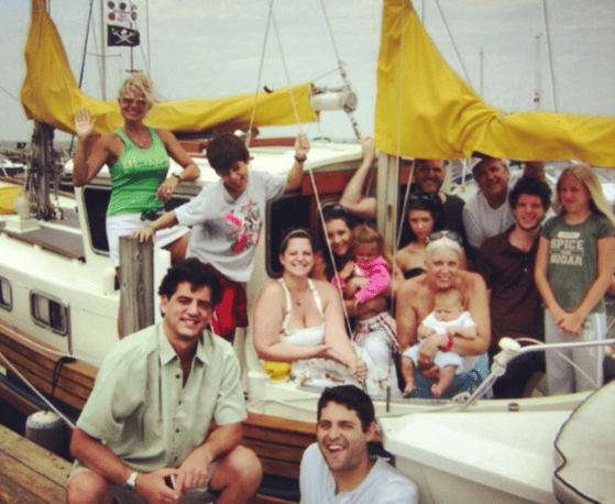 family posing for a picture on a boat
