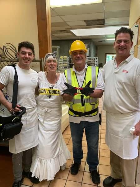 Family posing for picture wearing construction gear