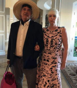 man and woman posing for a picture