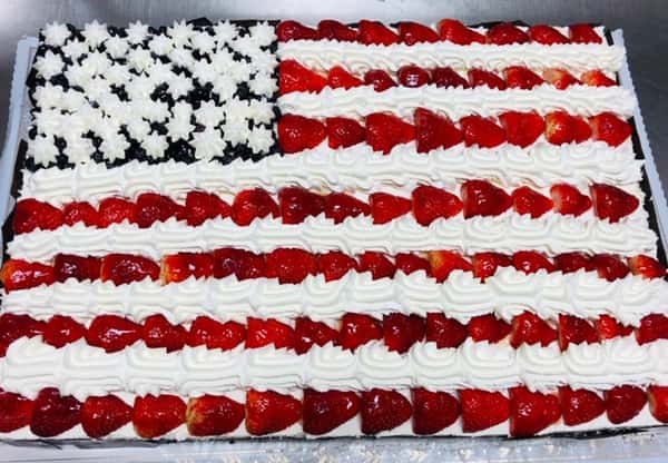 strawberries and blueberries in the shape of an American flag