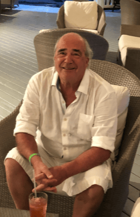 man sitting in a chair smiling